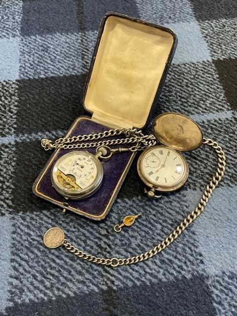 Lot 2 - A SILVER CASED POCKET WATCH, ONE OTHER AND TWO ALBERT CHAINS