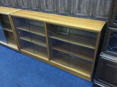 Lot 353 - A LOT OF FOUR MID CENTURY SLIDING GLASS DOOR BOOKCASES