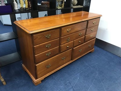 Lot 373 - A REPRODUCTION STAINED WOOD CHEST OF DRAWERS