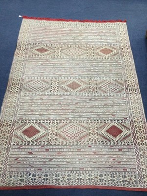 Lot 391 - A MOROCCAN BORDERED CARPET