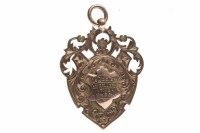 Lot 1111 - EDWARDIAN NINE CARAT GOLD MEDAL cartouche with...