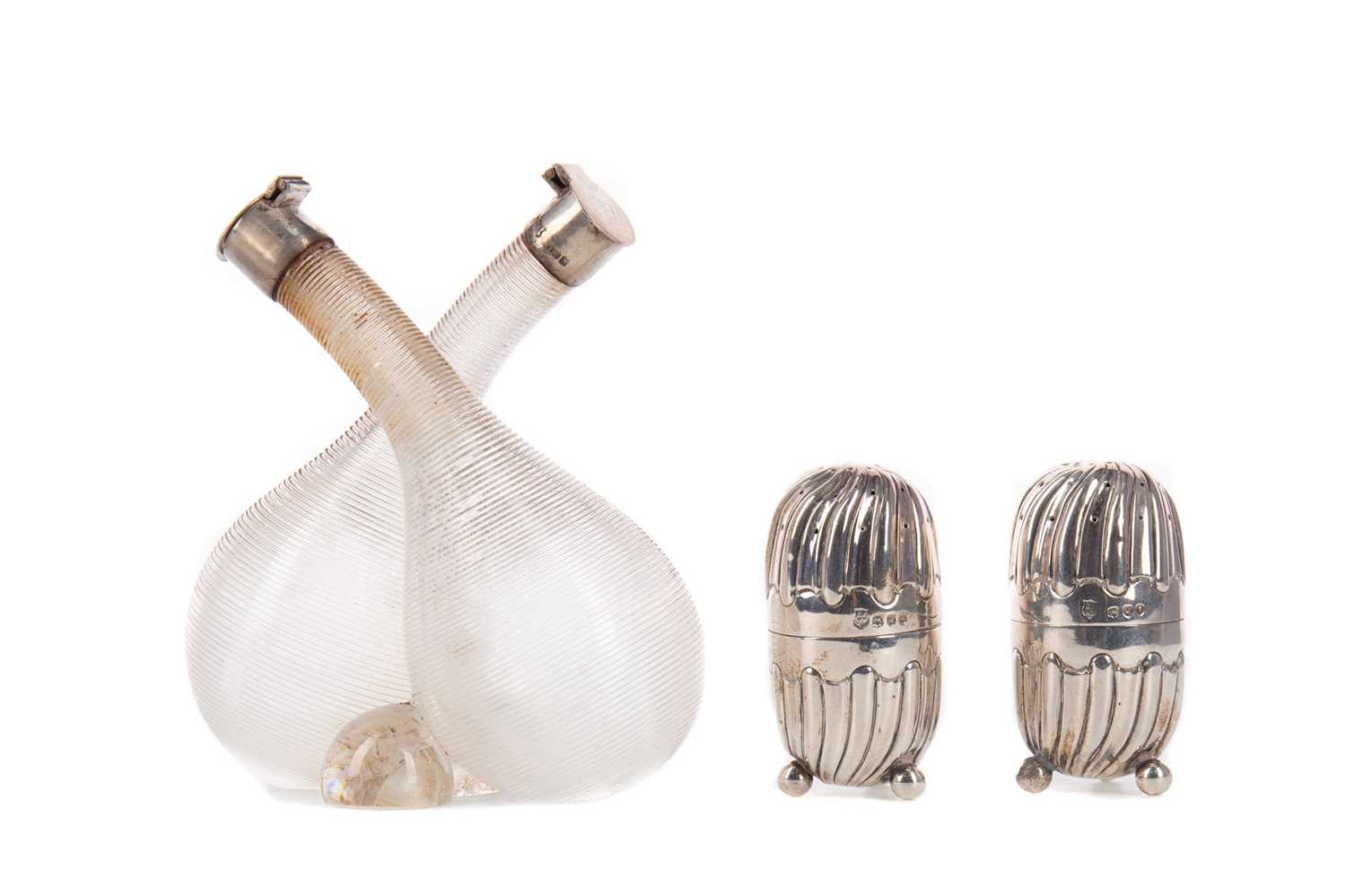 Lot 522 - A PAIR OF LATE VICTORIAN PEPPERETTES, ALONG WITH A VINEGAR AND OIL BOTTLE