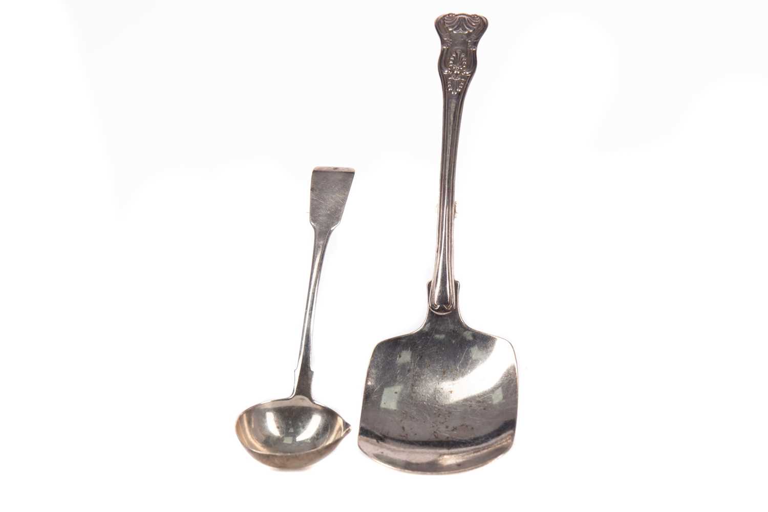 Lot 533 - A WILLIAM IV SILVER PASTRY SCOOP AND AN IRISH SAUCE LADLE