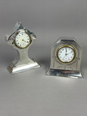 Lot 9 - A LOT OF TWO EARLY 20TH CENTURY SILVER CASED MANTEL CLOCKS