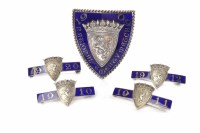 Lot 1124 - GROUP OF FIVE SILVER AND BLUE ENAMEL BADGES...