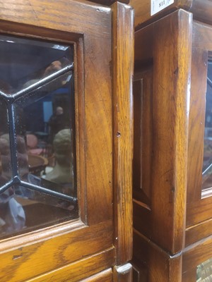 Lot 811 - A PAIR OF OAK SECTIONAL BOOKCASES