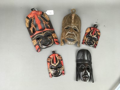 Lot 126 - A COLLECTION OF TRIBAL CARVED WOOD WALL MASKS