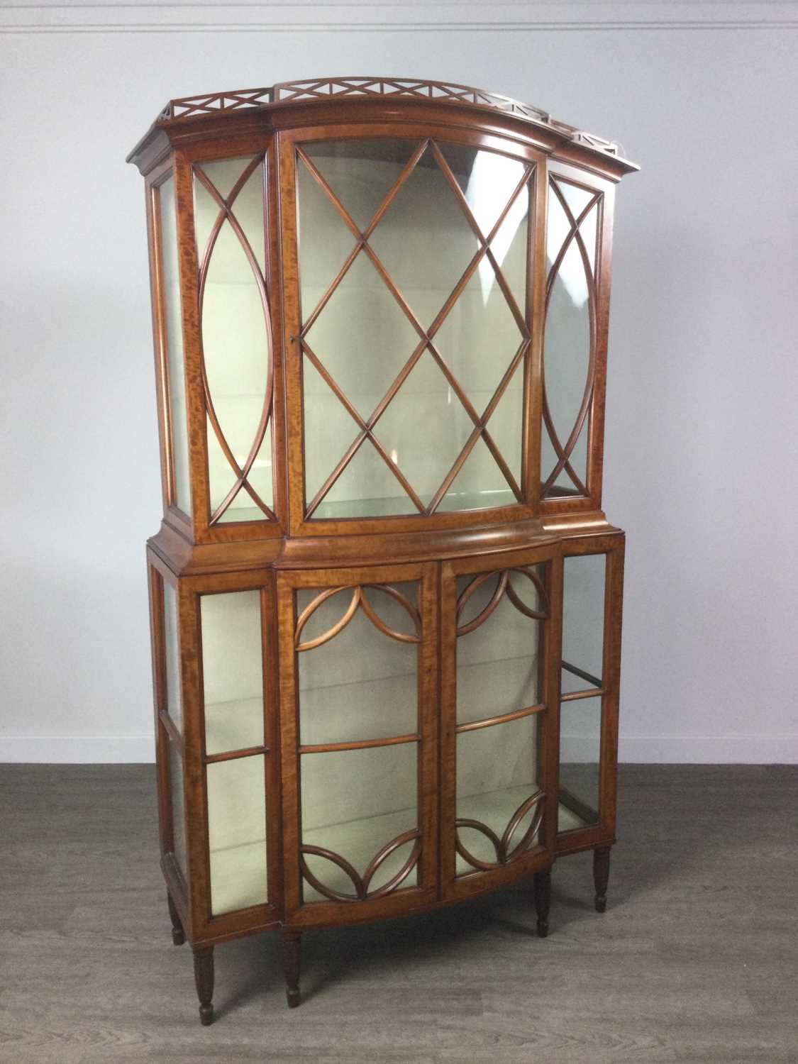 Lot 822 - A SATINWOOD DISPLAY CABINET BY MAPLE & CO
