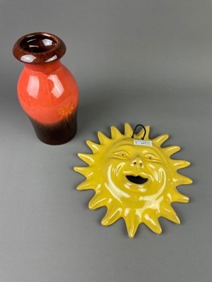 Lot 257 - A CERAMIC VASE AND A CERAMIC WALL HANGING OF THE SUN