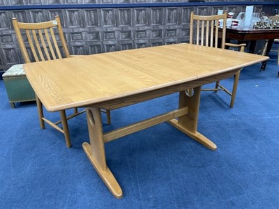 Lot 332 - AN ERCOL BLONDE OAK DINING TABLE AND SIX CHAIRS