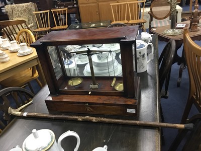 Lot 361 - A SET OF 20TH CENTURY BRASS SCALES IN A DISPLAY CASE AND A WALKING STICK