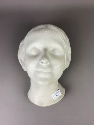 Lot 306 - A STUCCO SCULPTURE OF A FEMALE HEAD