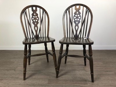 Lot 314 - A SET OF SIX WHEEL BACKED DINING CHAIRS