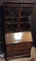 Lot 1268 - REGENCY MAHOGANY BUREAU BOOKCASE with dentil...