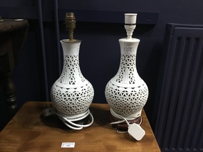 Lot 382 - A PAIR OF BLANC DE CHINE RETICULATED BALUSTER TABLE LAMPS