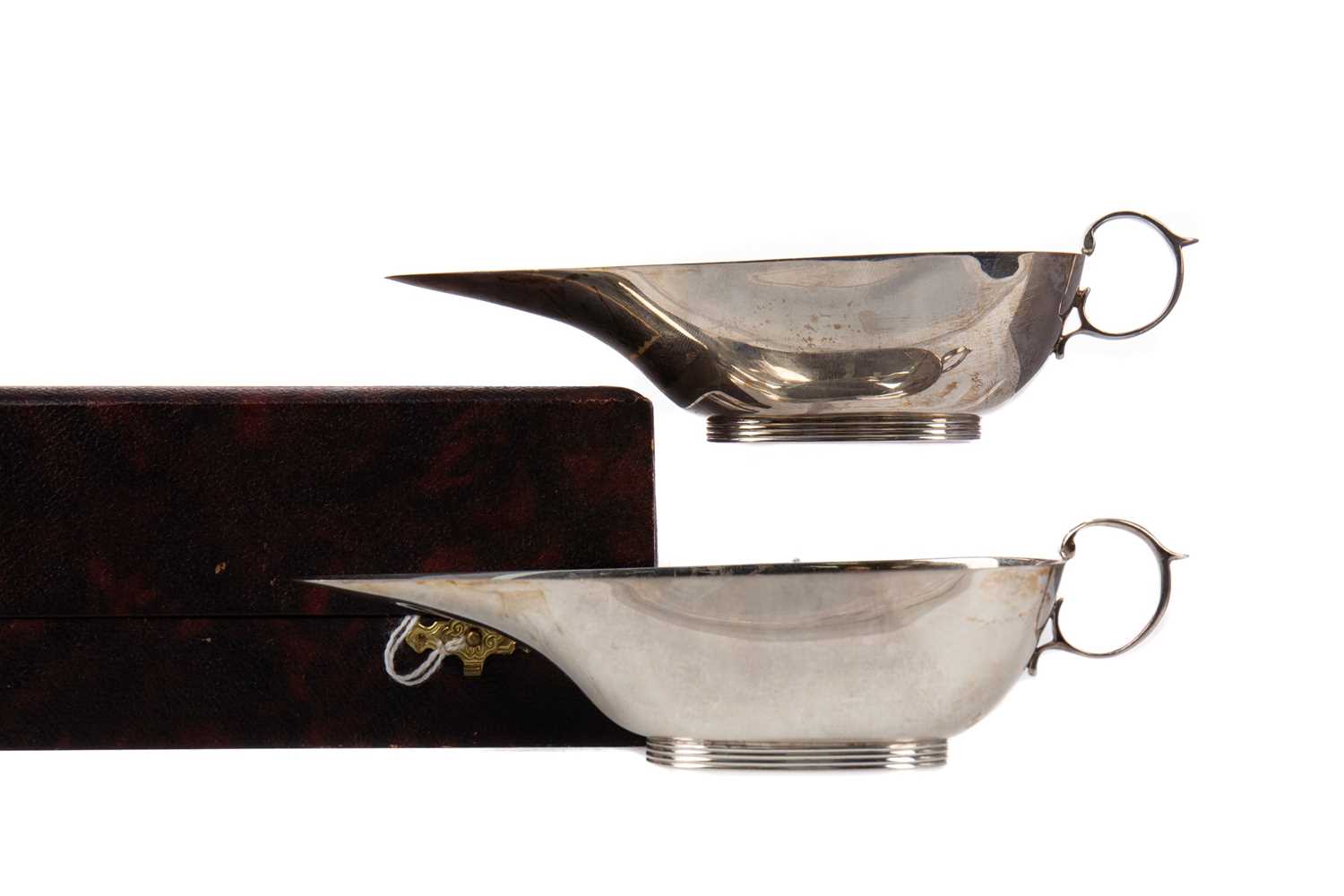 Lot 566 - A PAIR OF GEORGE VI SILVER SAUCE BOATS