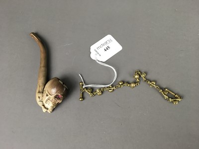 Lot 445 - A SMOKER'S PIPE AND AN ALBERT WITH SKULLS