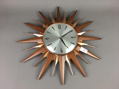 Lot 448 - A RETRO STARBURST QUARTZ WALL CLOCK BY METAMEC