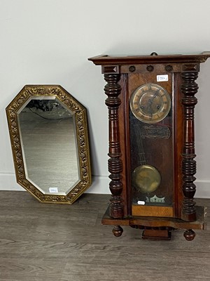 Lot 230A - AN OAK WALL CLOCK AND A BRASS EMBOSSED WALL MIRROR