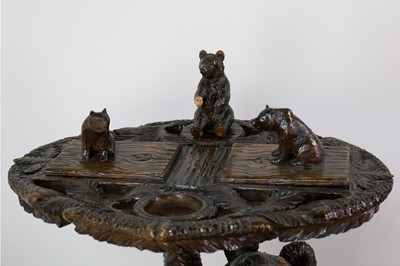 Lot 1302 - A GOOD BLACK FOREST SMOKING TABLE