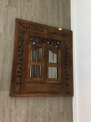 Lot 517 - A PIERCED MIRROR AND A REVOLVING BOOKCASE