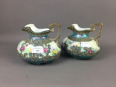 Lot 560 - A PAIR OF JAPANESE EWERS