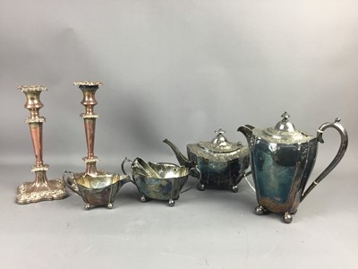 Lot 520A - A SILVER PLATED TEA SERVICE, ALONG WITH A PAIR OF CANDLESTICKS