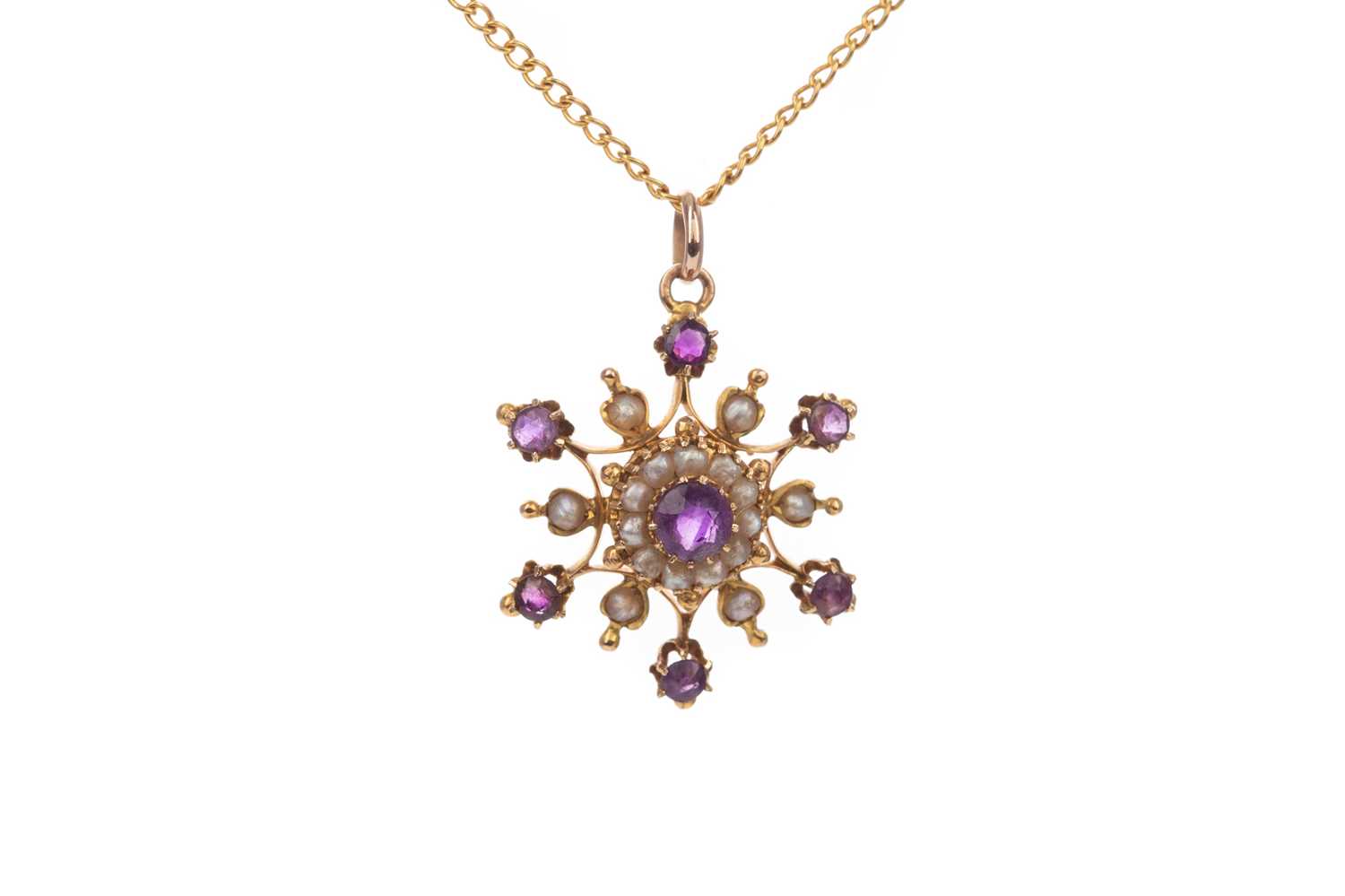 Lot 385 - AN AMETHYST AND SEED PEARL PENDANT