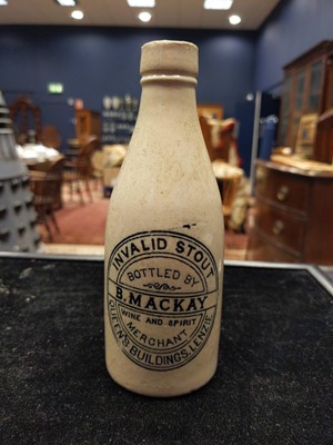 Lot 718 - A COLLECTION OF ADVERTISING STONEWARE BOTTLES AND JARS