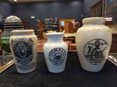Lot 718 - A COLLECTION OF ADVERTISING STONEWARE BOTTLES AND JARS