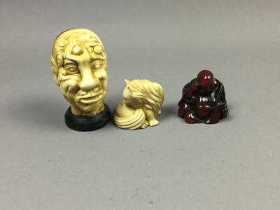 Lot 32 - A CHINESE NOVELTY RESIN HEAD STUDY ALONG WITH TWO RESIN NETSUKE