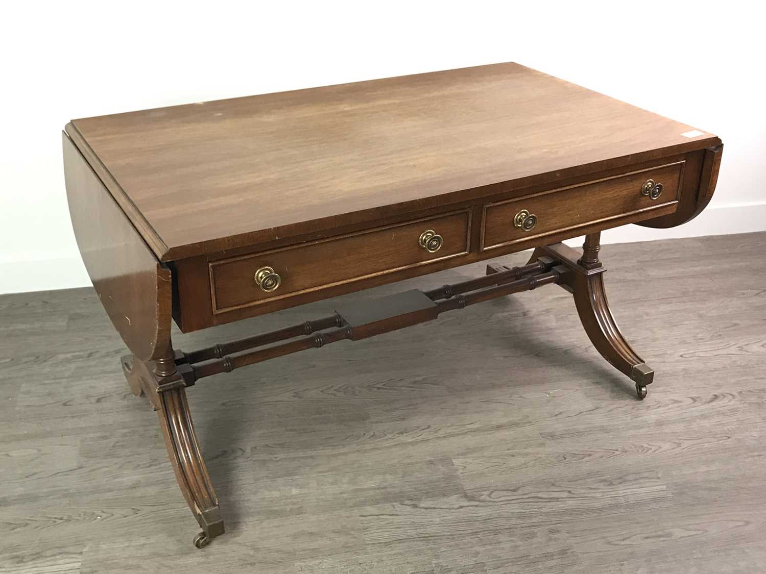 Lot 145 - A REPRODUCTION SOFA TYPE COFFEE TABLE