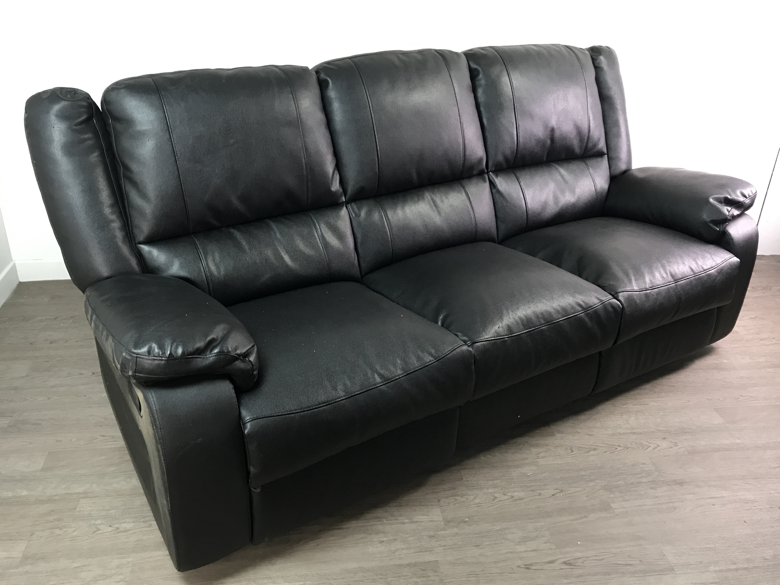 Lot 159 A LOT OF TWO BLACK LEATHER RECLINER SETTEES