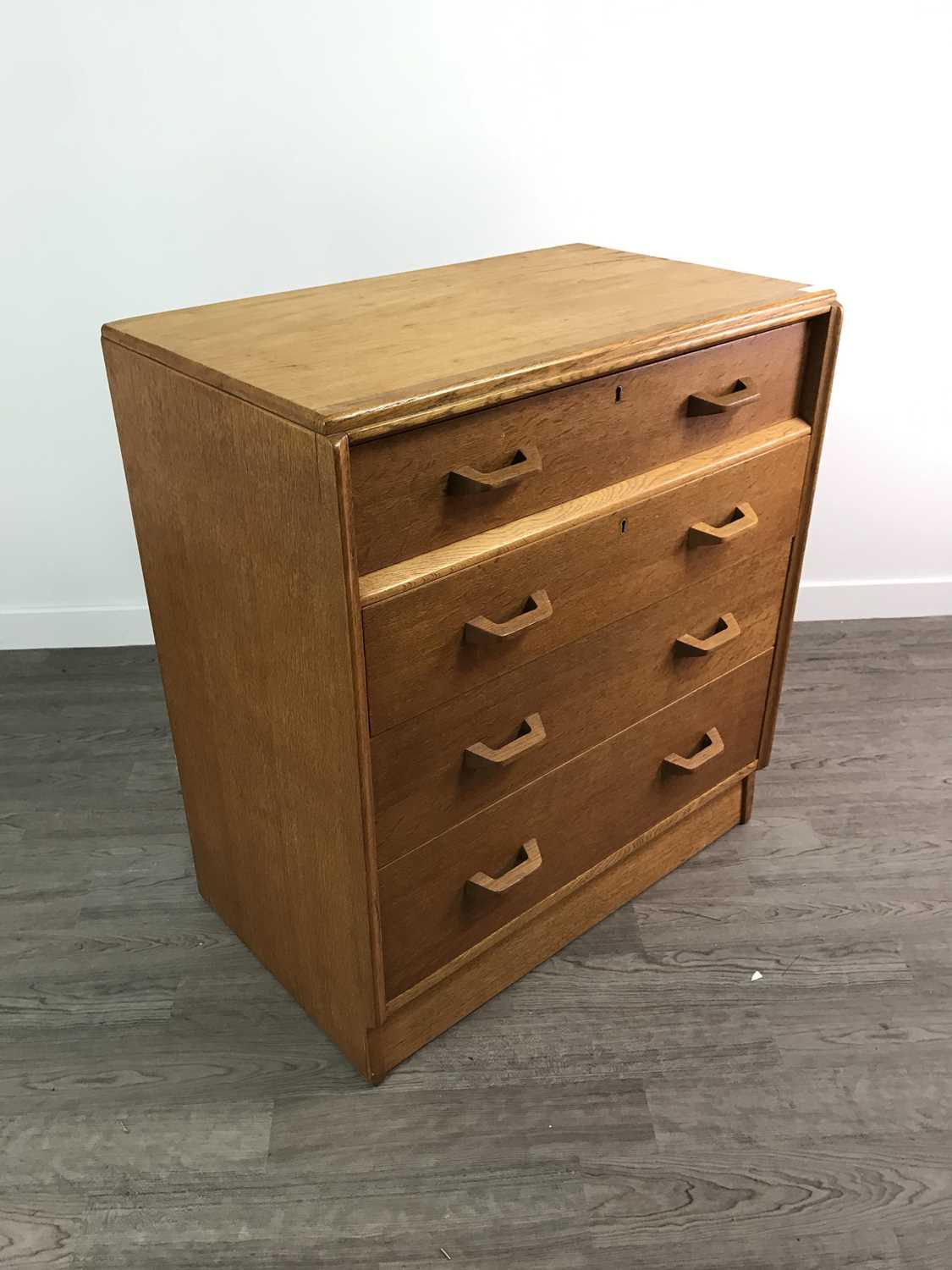 Lot 153 - A MID 20TH CENTURY OAK CHEST OF FOUR DRAWERS