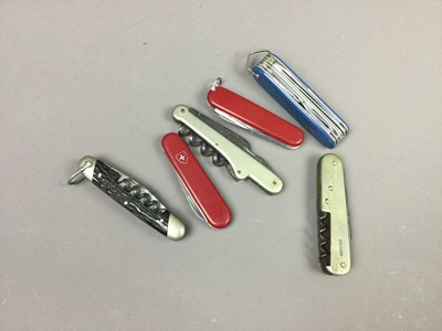 Lot 272 - A LOT OF THREE VICTORINOX SWISS ARMY KNIVES ALONG WITH THREE MULTI TOOL KNIVES