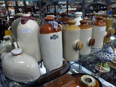 Lot 384 - A LOT OF TWELVE STONEWARE HOT WATER BOTTLES