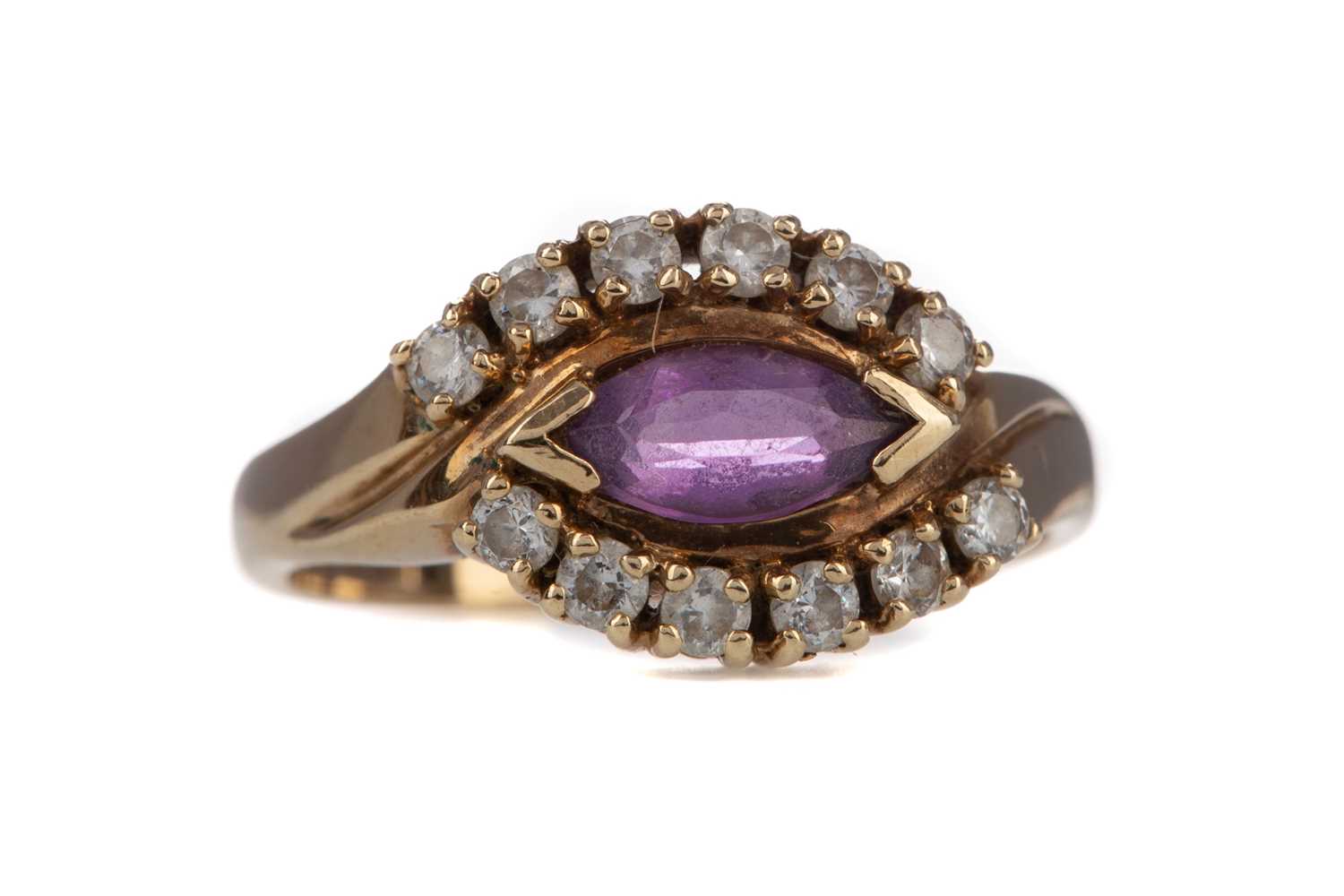 Lot 858 - AN AMETHYST AND WHITE GEM SET RING