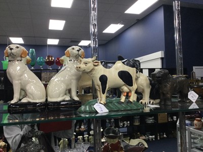 Lot 554 - AN EARLY 20TH CENTURY NUTCRACKER, DOOR STOPS AND A PAIR OF CERAMIC FIGURES OF DOGS