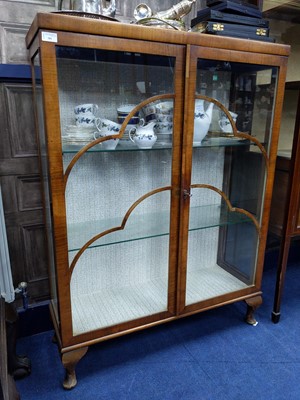Lot 381 - A WALNUT DISPLAY CABINET