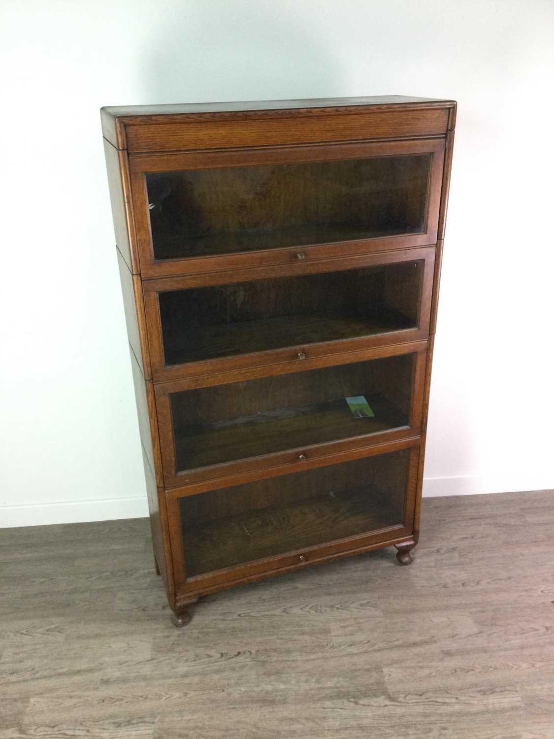 Lot 1350 - AN EARLY 20TH CENTURY BARRISTER’S OAK SECTIONAL BOOKCASE