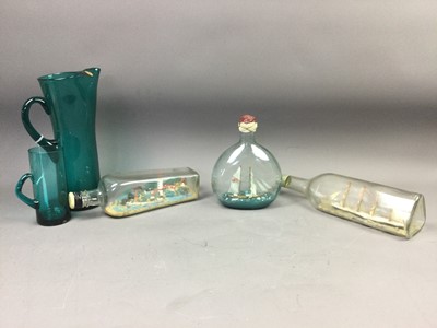 Lot 563 - A GREEN GLASS LEMONADE SET AND FOUR SHIPS IN BOTTLES