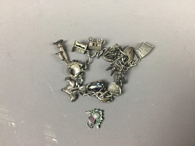 Lot 577 - A SILVER CHARM BRACELET