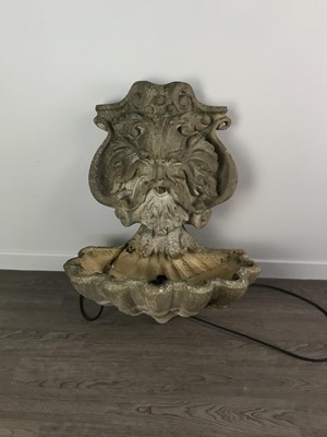 Lot 447 - A WALL MOUNTING SIMULATED STONE GARDEN WATER FEATURE