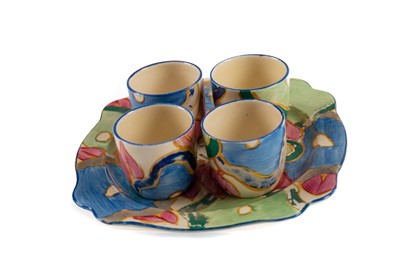 Lot 757 - A BIZARRE BY CLARICE CLIFF BLUE CHINTZ SET OF FOUR EGG CUPS ON STAND
