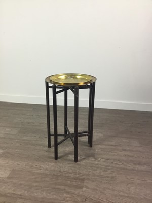 Lot 381 - AN EASTERN FOLDING TABLE WITH BRASS TRAY TOPS