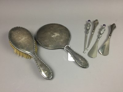 Lot 616 - A SILVER HAND MIRROR AND BRUSH, ALONG WITH BUTTON HOOK AND SHOE HORN SETS