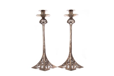 Lot 1394 - A PAIR OF SILVER PLATED BRASS SECESSIONIST CANDLESTICKS