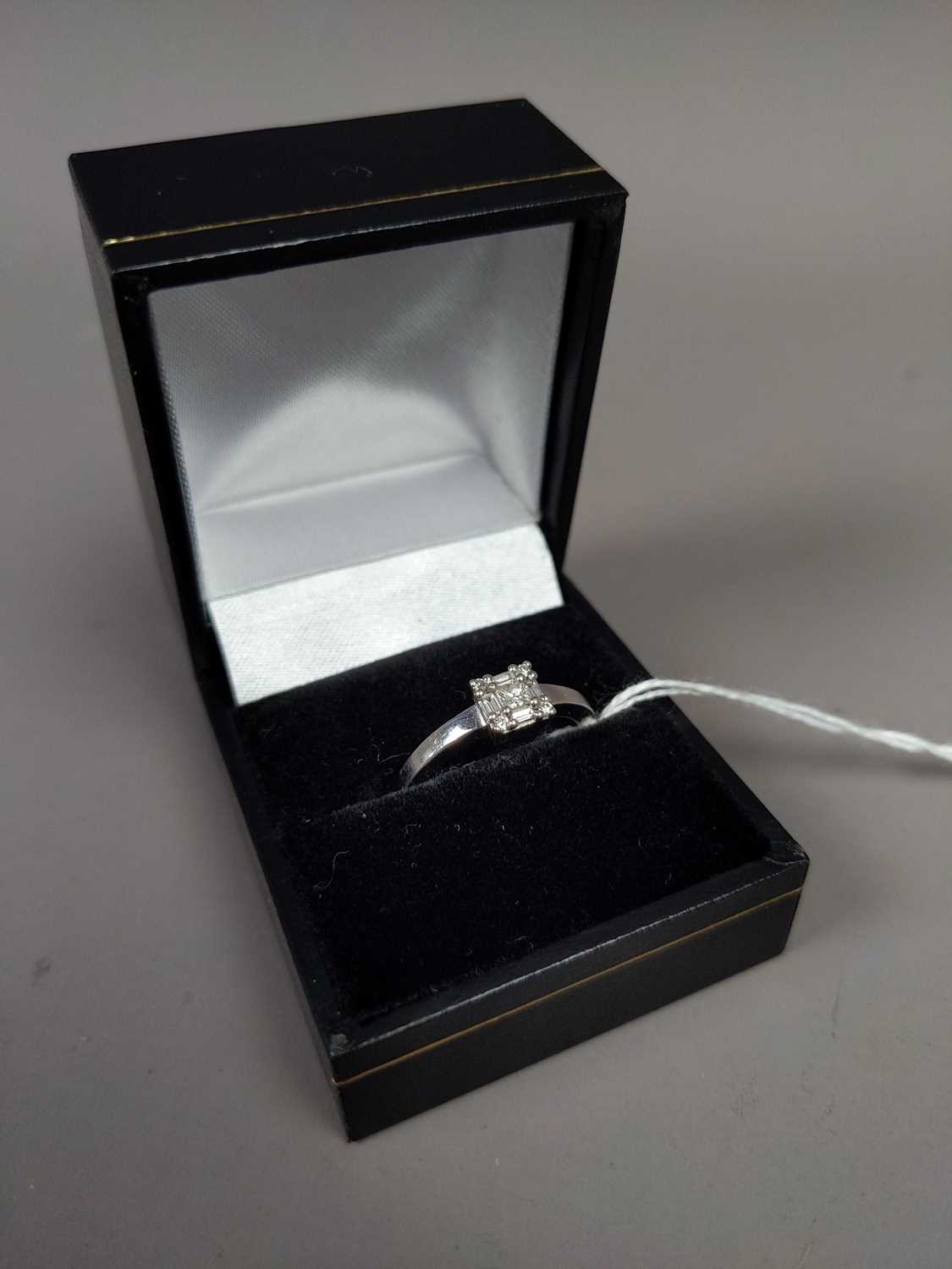 Lot 25 - A DIAMOND SOLITAIRE RING SET IN  NINE CARAT GOLD