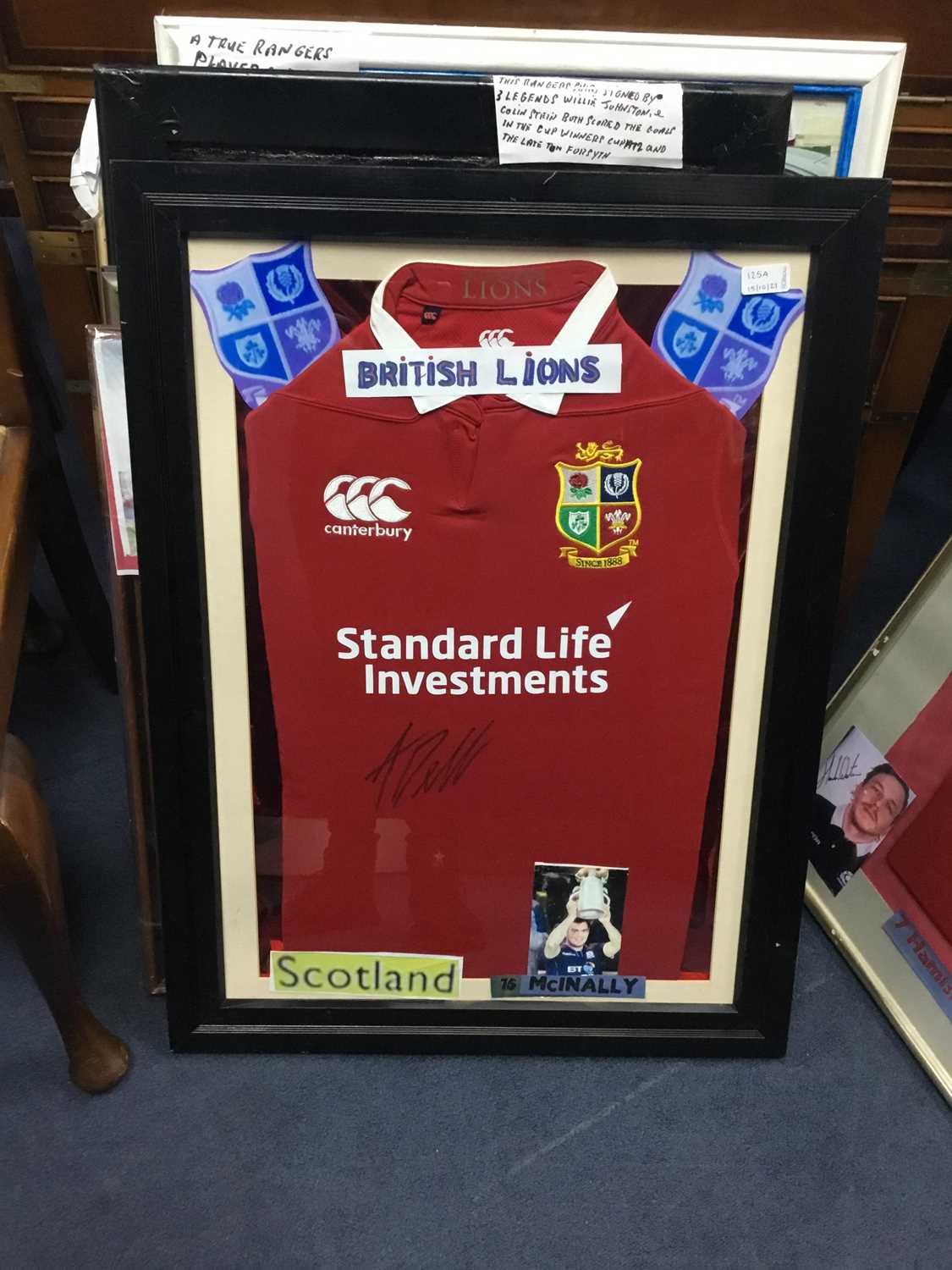 Lot 125 - A FRAMED BRITISH AND IRISH LIONS JERSEY