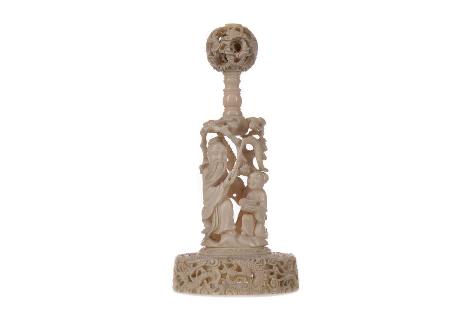 Lot 1653 - A SMALL CHINESE IVORY CONCENTRIC BALL ON STAND